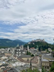 Photo of old city scape with the Fortress Hohensalzburg on the top right