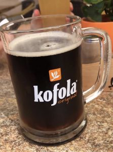 A glass of kofola