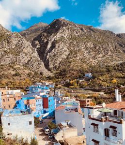 Chefchauen in Morocco known as the Blue City because all the buildings are blue. This city is at the foot of mountains in the background.