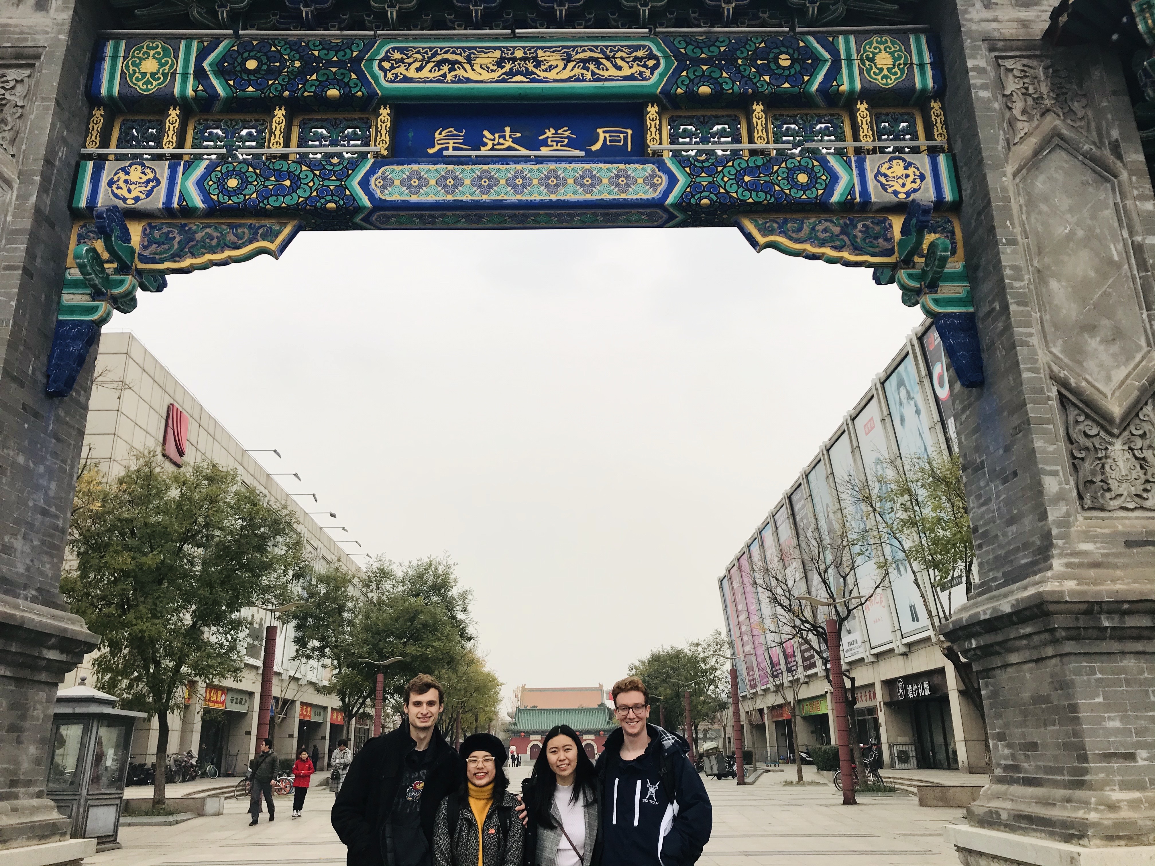 Students standing Underneath an arch in Tianjin