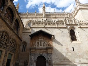 The Royal Chapel of Granada from the outside. Blue skies and white clouds create a dreamy effect over the Chapel.
