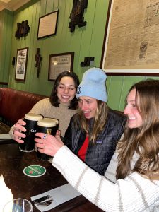 Students in a pub drinking Guiness beer.