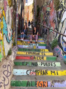 Izzy and I posing with a famous set of stairs that have the lyrics of "Calle 13" by Latinoamérica painted on them