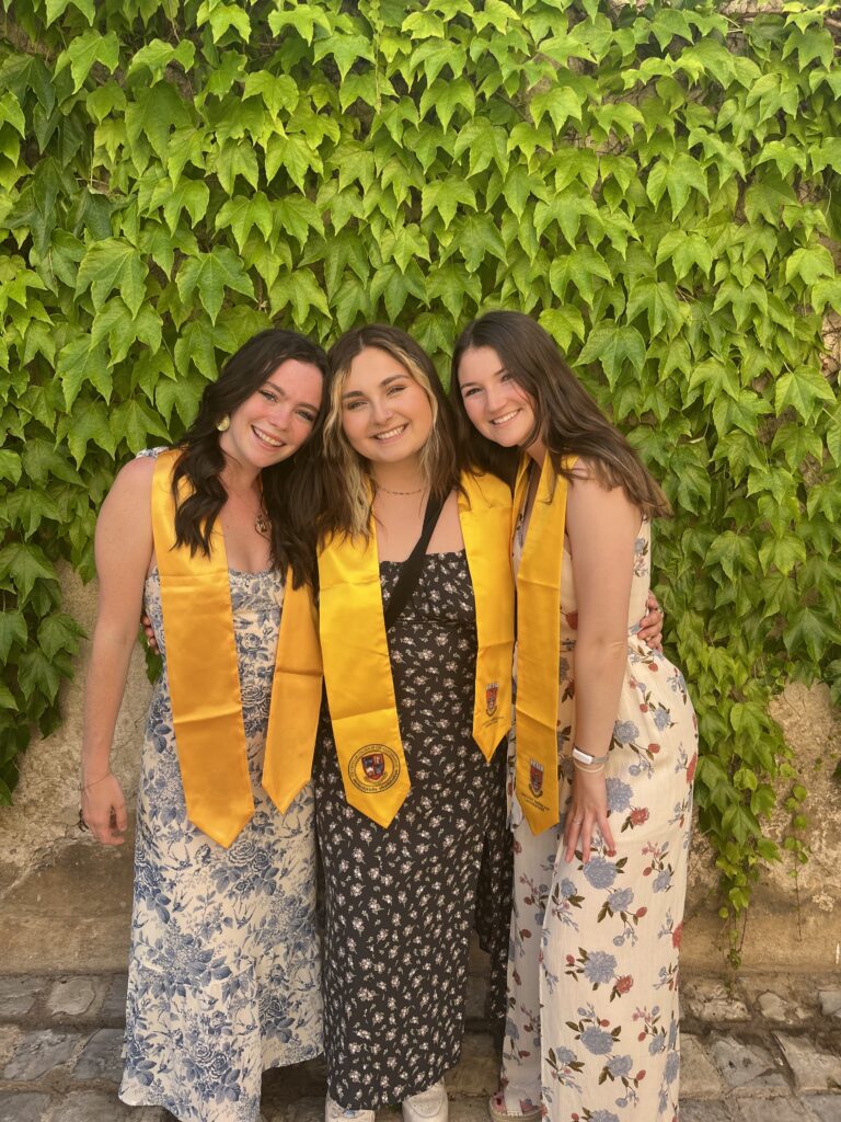 3 young women posing for a graduation picture