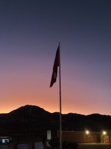 Sunrise before seeing the Geysers, featuring the Chilean flag