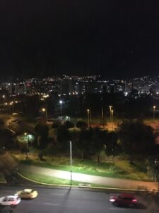 City lights of Quito at night as seen from a hill.