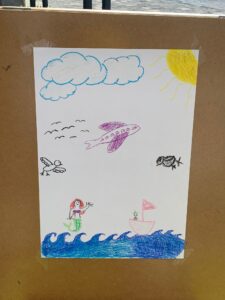 This is a photo drawn by Nati and I. It depicts the sea, but with birds, a ship, Ariel, and an airplane.