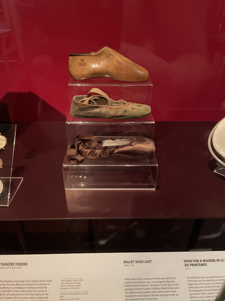 a shoe last, an early pointe shoe, and a modern pointe shoe for ballet