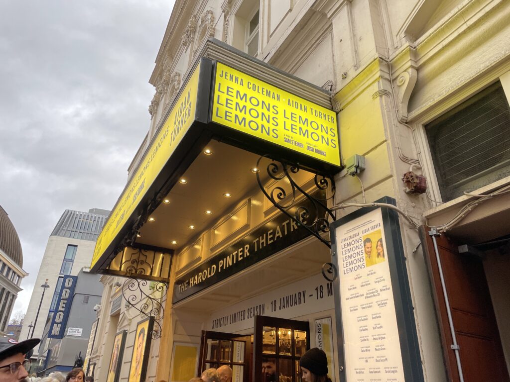 a theatre marquee, yellow, with the word Lemons in a repeating pattern