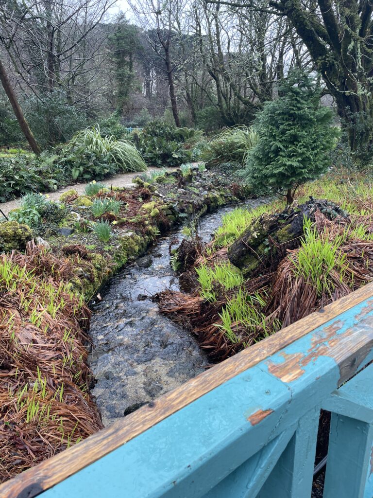 a river and a turquoise bridge