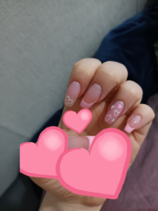 pink fake nails.