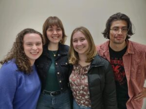 From left to right: Lizzie, Sage, Rachel, and Andrew smile for the camera at an orientation event for all students studying abroad.