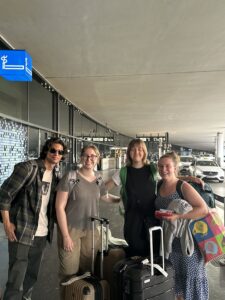 From left to right; Andrew, Rachel, Sage, and Lizzie beam at the camera after arriving in Vienna after their over 24 hour travel day