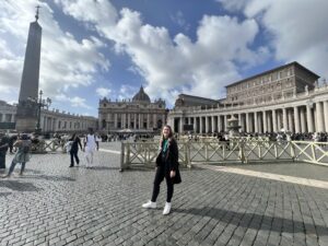Clara standing in the open square outside the Vatican 