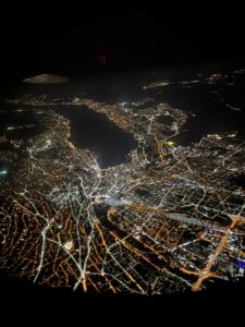 A photo of the lit-up ground while up in a plane.