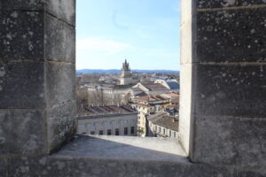 View of the city of Avignon from the roof of the Palais des Papes framed by two stone columns