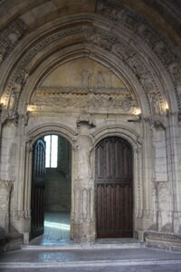 Image of two doors within the Palais des Papes with carved stone framing the two doors