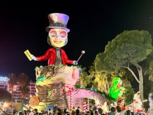 Float in the parade of lights with a very large Willy Wonka figure.