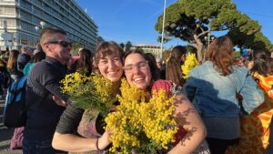 My friend and I holding Mimosa Flowers at the opening parade.