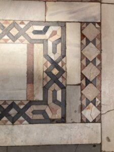 Design of inlaid tiles made out of colored stone and ivory on the floor of a mosque