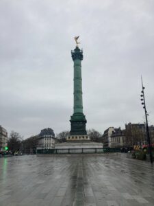 Tower of Place de la Bastille. It is a copper column, now green, with a golden winged statue adorning the top.