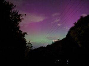 purple and green sky at night