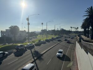 cars driving under bridge