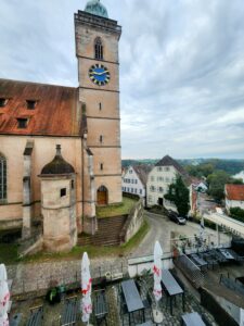 A beautiful stone cathedral in Nürtingen, Germany, with a tall bell tower.