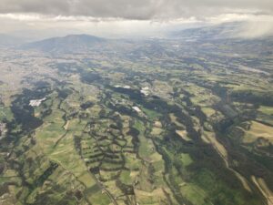 Flying into Quito, with it's green tree-covered hills.