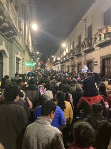 The festivities of Ecuador's Independence Day in Quito's old town with people packing the streets.