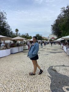 Girl standing at a market