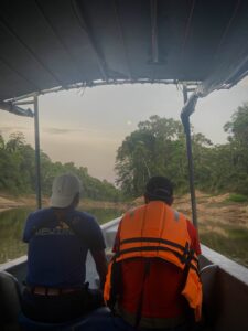Traveling by boat down the Tiputini River.