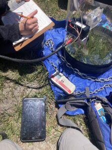 Field survey equipment for soil sampling in action.