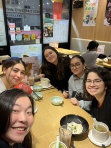Girls around a table having tea and soup on a cold day.