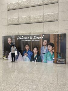 Welcome to Korea board with K-pop group NewJeans