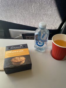 AIRPLANE snacks were a warm cupcake, cocoa and bottle of water.