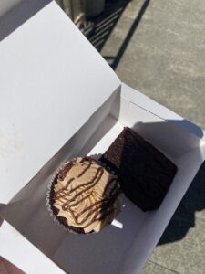 A nutella cupcake drizzed with chocolate.