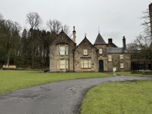 A Stone castle at the end of a long concrete path