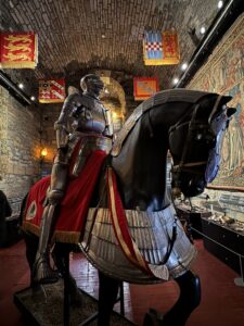 Statue of a knight riding a horse, displayed in the Dean Castle.
