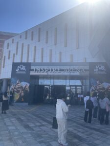Entrance to Le Sserafim concert at the INSPIRE ARENA, billboard of group on top of door 