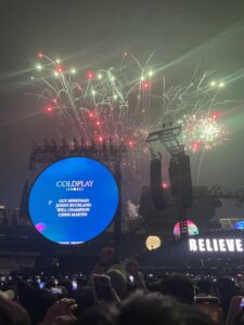 Fireworks blooming through the sky after Coldplay concert for celebration