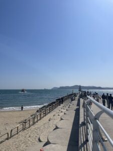 Haeundae Beach - blue sky over a big blue ocean with a walkway out to the water.