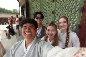 Photo of my friends and I in front of a building at the Gyeongbokgung palace