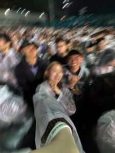 Photo with my friends in the pouring rain having a good time at the concert