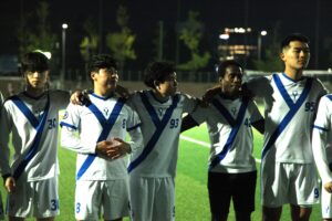 Photo of me along with my teammates in a huddle before football match